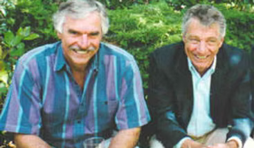 Del and Ron, founders of DOORFRAMER, INC. sitting outside.